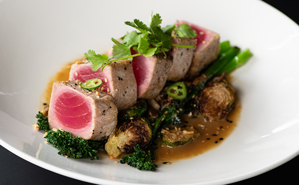 Pan seared ahi with vegetables available at Yard House Waikiki