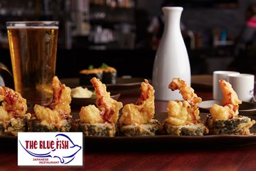 a plate of sushi with fried shrimp on it