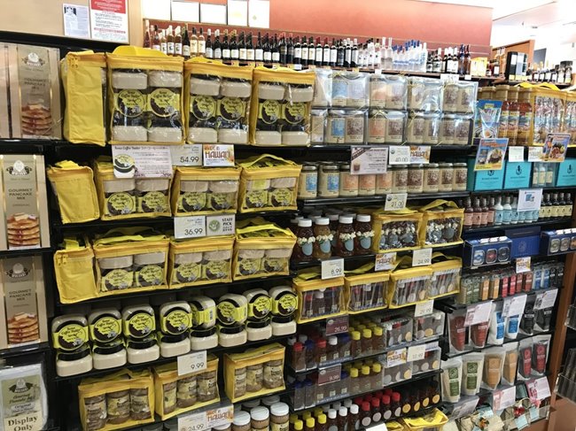 Shelf displaying ABC Stores' selection of Hawaiian honey & Kona Coffee Butter