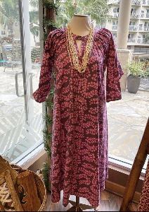 Brown & pink Ginger dress with tapa pattern on mannequin