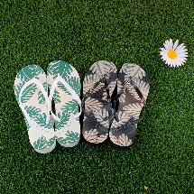 2 pairs of Vionic beach sandals in white & blue as well as black & grey with a tropical leaf pattern