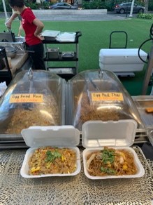 Open takeout container of pad thai and fried rice by Oh's Kitchen in Waikiki