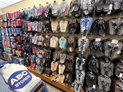 a wall of sandals and slippers